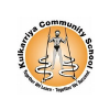 logo for a community school with an orange circular emblem and a stylized seated figure at the center, surrounded by black text around the edge